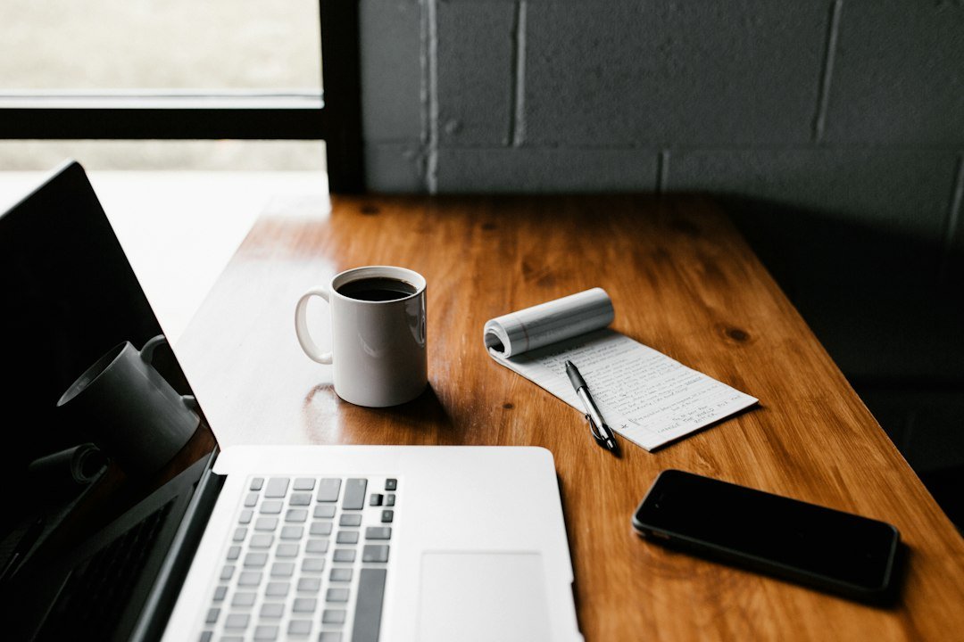 Person typing on a laptop to set up an email marketing automation workflow
