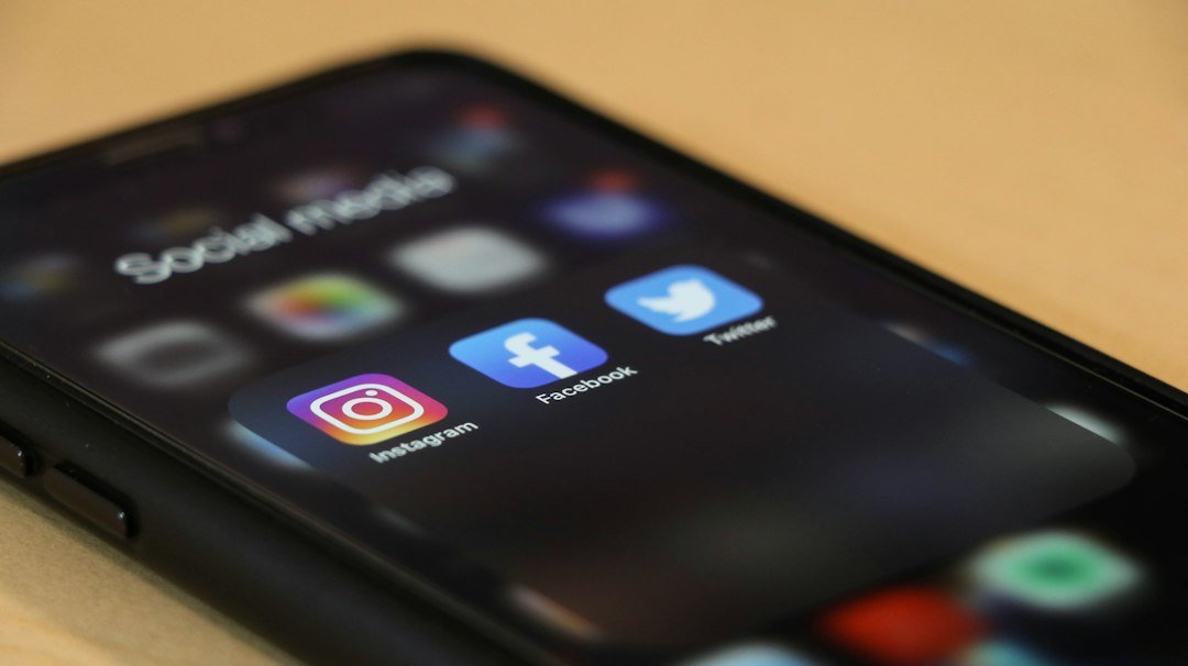 Smartphone resting on a wooden table, ready for scheduling social media posts