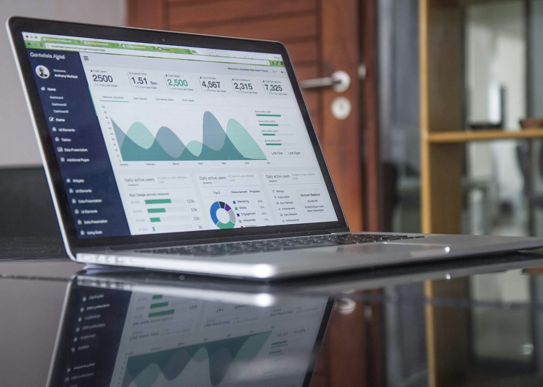 Website traffic statistics displayed on a laptop used to track SEO results